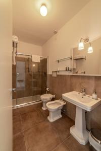 a bathroom with a toilet and a sink and a shower at San Leo Albergo Diffuso in San Leo