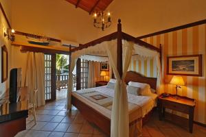 Cama ou camas em um quarto em Manary Praia Hotel