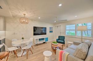 a living room with a couch and a table at Luxe Naples Escape Walk to Beach and Downtown! in Naples