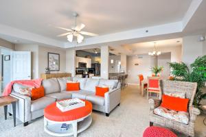 a living room with a couch and a table at Panorama Waterfront Paradise Condo with Patio! in Lake Ozark