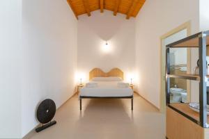 Ліжко або ліжка в номері Baglio Cella - Appartamenti per Vacanze