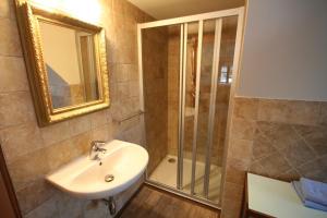 a bathroom with a sink and a shower at U Jindrů in Abertamy +37 photos