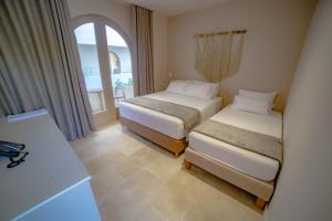 Loa Tolú by Bernalo Hotels客房内的一张或多张床位