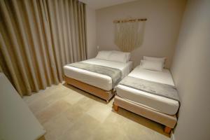 Postel nebo postele na pokoji v ubytování Loa Tolú by Bernalo Hotels + 37 fotografií