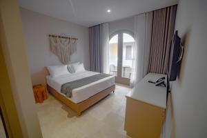 Loa Tolú by Bernalo Hotels客房内的一张或多张床位