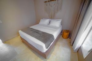 Loa Tolú by Bernalo Hotels客房内的一张或多张床位