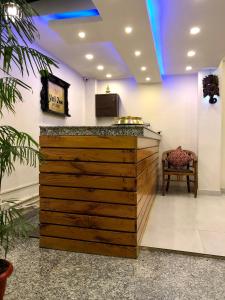 a bar in a hospital lobby with a chair at Yeti Inn Pvt. Ltd. in Kathmandu