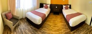 Postel nebo postele na pokoji v ubytování Yeti Inn Pvt. Ltd.