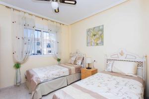 Postel nebo postele na pokoji v ubytování CH Lolita Ciudad Quesada + 36 fotografií