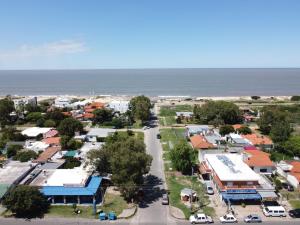 an aerial view of a small town next to the ocean at Departamentos LT3 in Las Toscas
