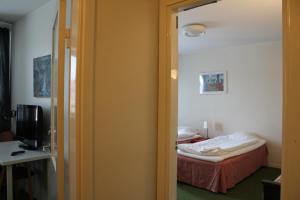 Postel nebo postele na pokoji v ubytování Hotel Tre Stockar