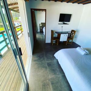 TV a/nebo společenská místnost v ubytování Hotel MANDALA