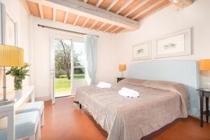 Voodi või voodid majutusasutuse B&B Borgo di Pratavecchie toas