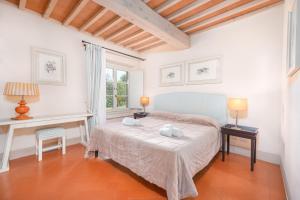 Voodi või voodid majutusasutuse B&B Borgo di Pratavecchie toas