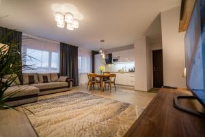 a living room with a couch and a table at Otepää Holiday Apartment in Otepää