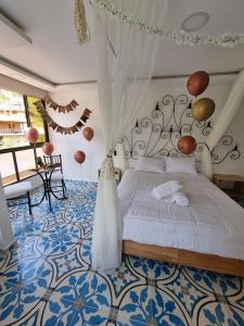 Postel nebo postele na pokoji v ubytování Hotel Bahia Del Faro