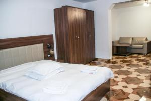 Katil atau katil-katil dalam bilik di Hotel Corina