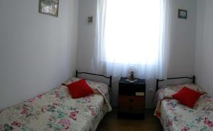 Postel nebo postele na pokoji v ubytování Apartman Ruža