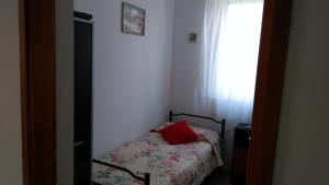 Postel nebo postele na pokoji v ubytování Apartman Ruža