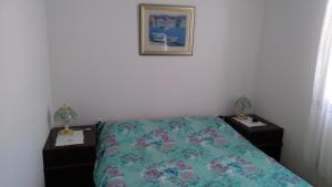 Postel nebo postele na pokoji v ubytování Apartman Ruža