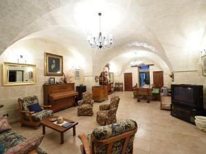 TV a/nebo společenská místnost v ubytování Agriturismo Antica Masseria i Cocci