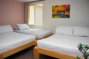 Säng eller sängar i ett rum på Hotel Valle de Pubenza