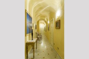 Televízia a/alebo spoločenská miestnosť v ubytovaní Relais Dei Mercanti B&B And Suites