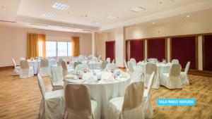 a banquet hall with white tables and chairs at Vila Galé Salvador in Salvador +35 photos