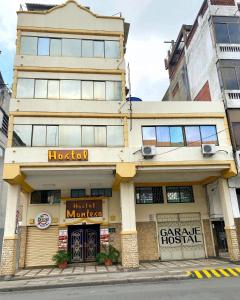 a building on the corner of a street at Hostal Montesa in Guayaquil