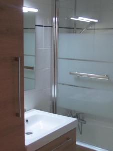 a white bathroom with a sink and a shower at Val Thorens 2 bedrooms 6 persons next slopes in Val Thorens +17 photos