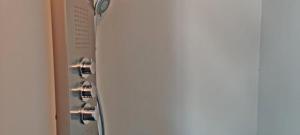 a close up of a refrigerator next to a door at Hotelhuisje Warmenhuizen #C in Warmenhuizen