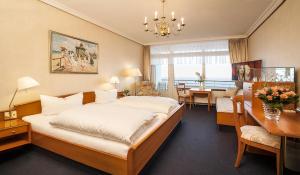 Postel nebo postele na pokoji v ubytování Strandhotel Monbijou GmbH garni