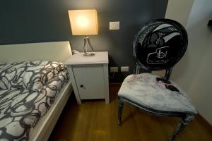A bed or beds in a room at The Photos Room B&B