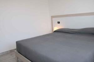 A bed or beds in a room at Apartment in Lazise - Gardasee 40490