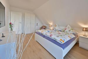 Ένα ή περισσότερα κρεβάτια σε δωμάτιο στο Holiday home in Poseritz - Insel Rügen 41511