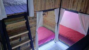 an overhead view of a room with a bed and curtains at The Host Puerto Iguazú in Puerto Iguazú