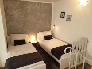 two beds in a small room with at Apartment in Postojna 40257 in Postojna