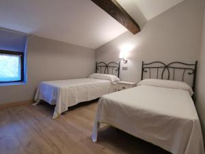 En eller flere senge i et værelse på La Casina del Trasgu