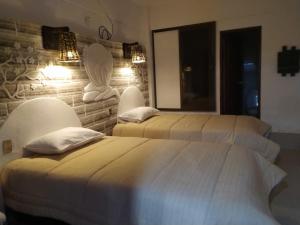 Hotel Kachi de Uyuni tesisinde bir odada yatak veya yataklar