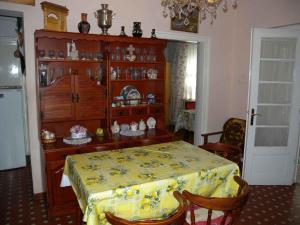 a dining room with a table with a yellow table cloth at Holiday home in Balatonfenyves 38166 in Balatonfenyves