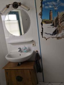 a bathroom with a sink and a mirror at Apartment in Sellin/Insel Rügen 37917 in Sandort