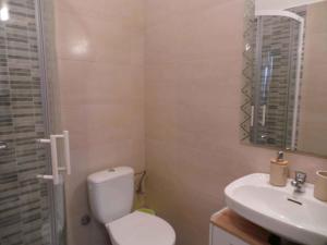 a bathroom with a toilet and a sink at Apartment in Umag/Istrien 37005 in Umag