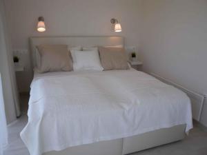 a white bed with white sheets and pillows at Studio in Siofok/Balaton 27759 in Siófok