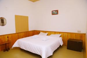 Postel nebo postele na pokoji v ubytování Celestial Resorts