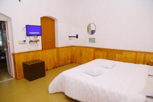 Postel nebo postele na pokoji v ubytování Celestial Resorts