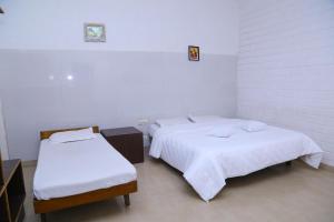 Postel nebo postele na pokoji v ubytování Celestial Resorts