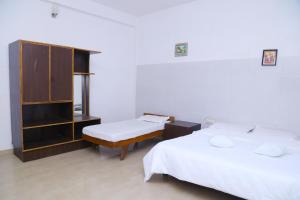 Postel nebo postele na pokoji v ubytování Celestial Resorts