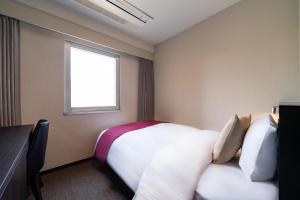 Postel nebo postele na pokoji v ubytování Hotel Shuranza Chiba