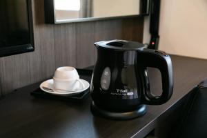 Příslušenství pro přípravu čaje a kávy v ubytování Hotel Shuranza Chiba