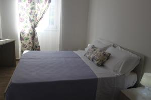 Postel nebo postele na pokoji v ubytování Messapia Casa Vacanze